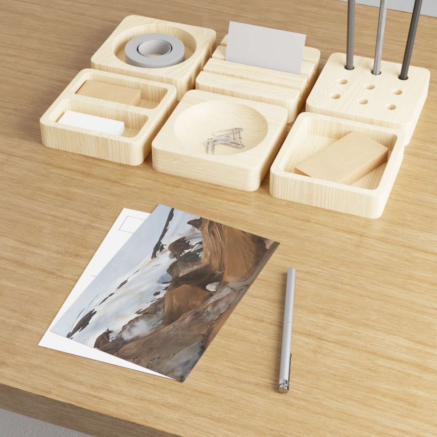 Kerlingarfjöll laying on a cluttered wooden desk