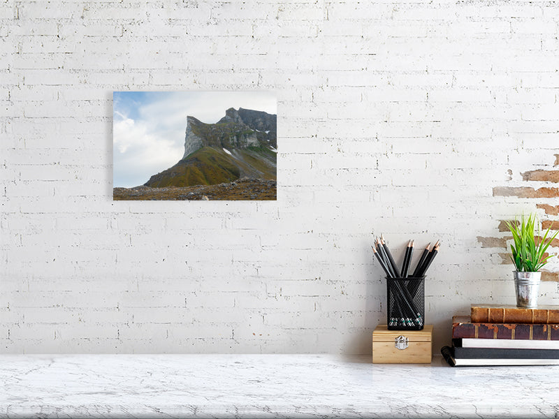 Mockup of a print of the mountain hanging on a white brick wall
