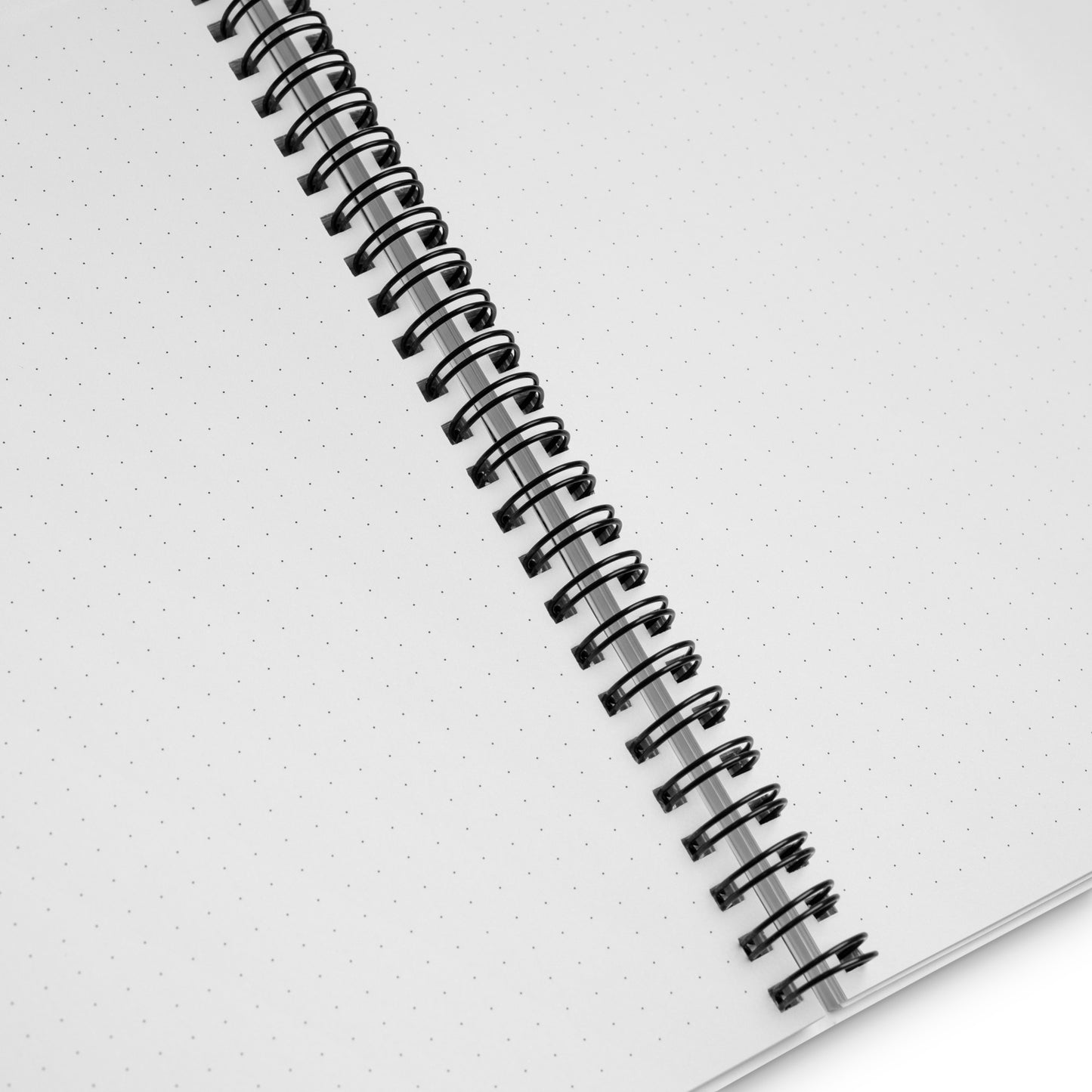 Close up of the notebook paper: white paper with gray dots