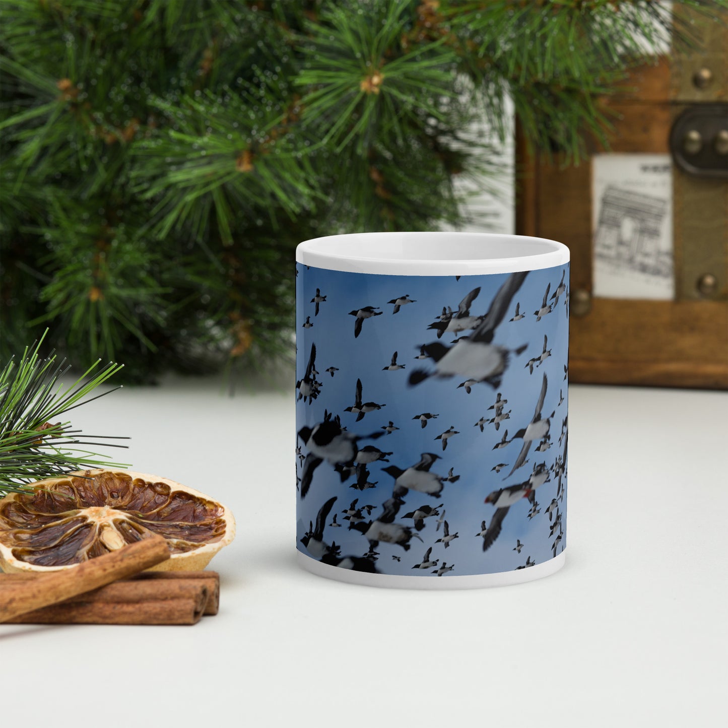 Mug with a print of hundreds of auks flying