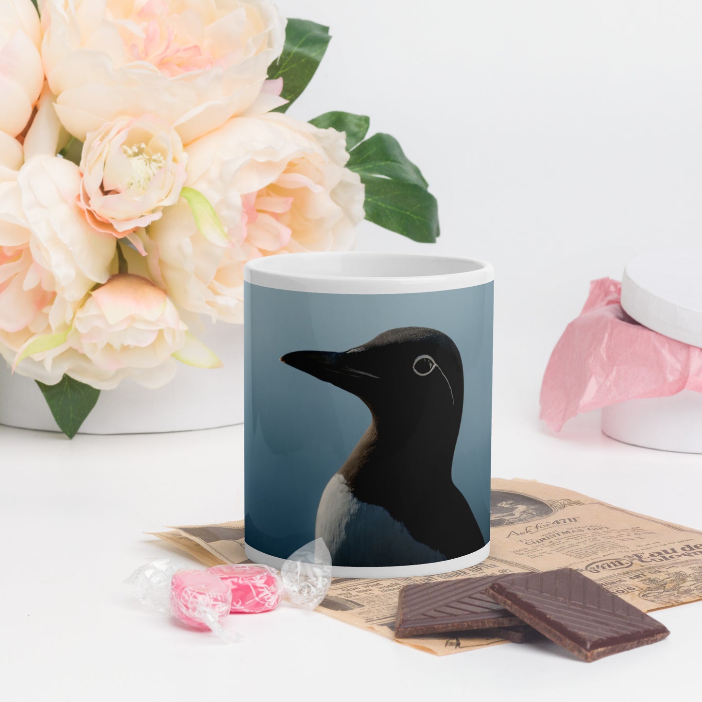 Portrait of a bridled common murre, displayed on a white glossy mug