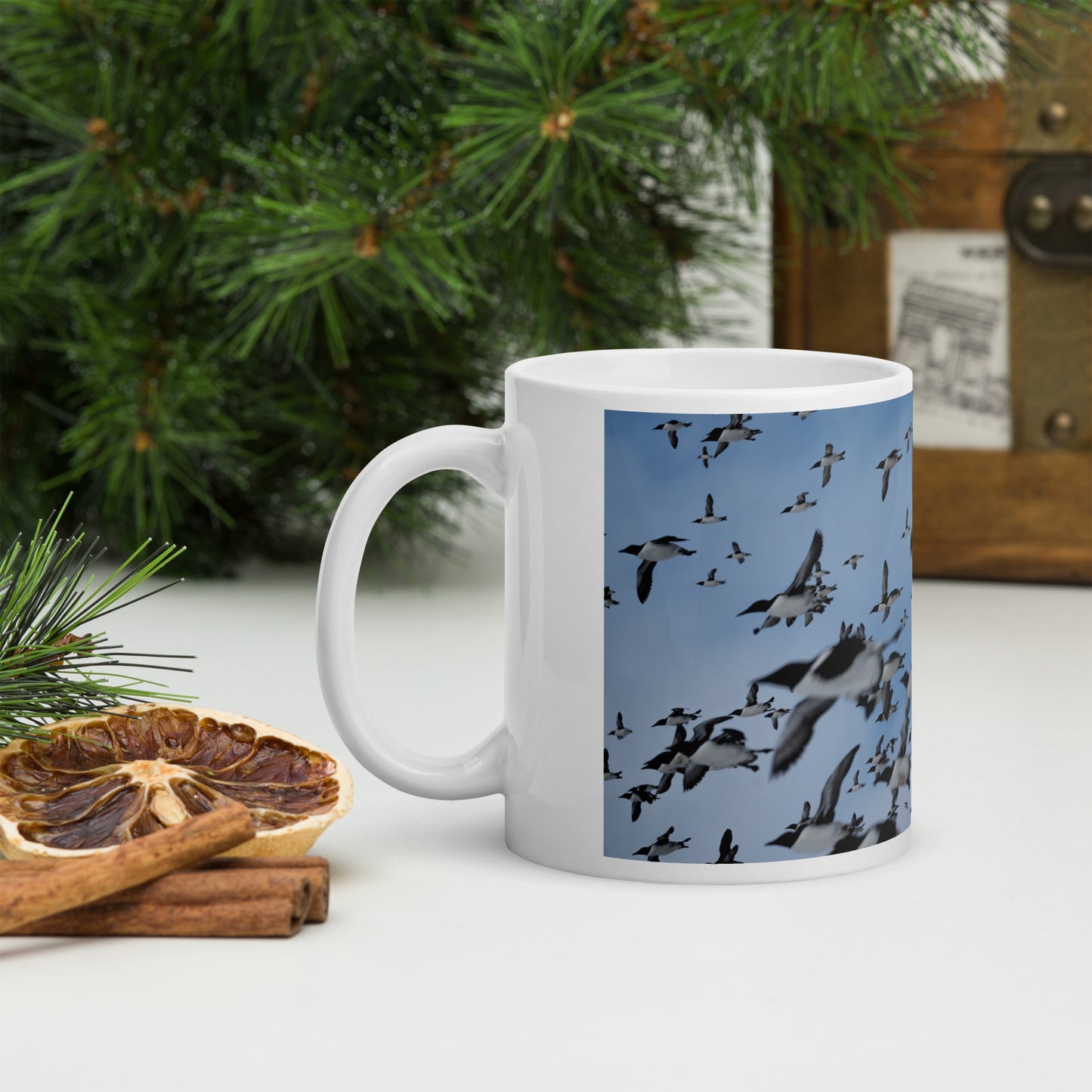 Mug with a print of hundreds of auks flying