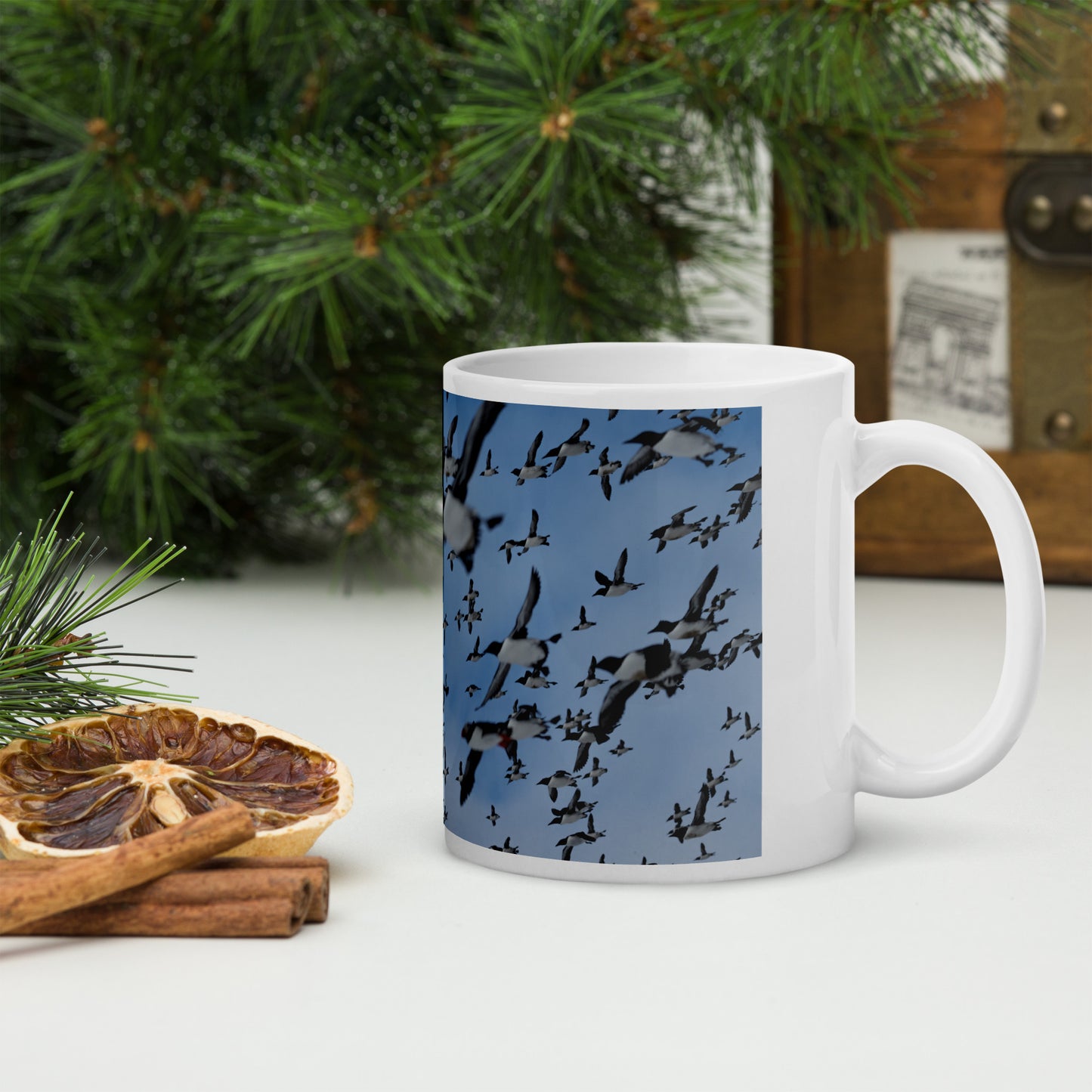Mug with a print of hundreds of auks flying